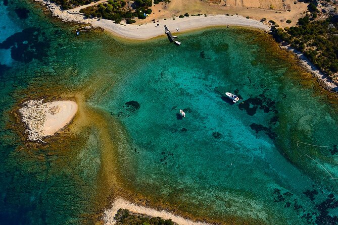 Blue and Green Cave Speedboat Excursion from Hvar Town - Stiniva Cove, a narrow beach beneath cliffs