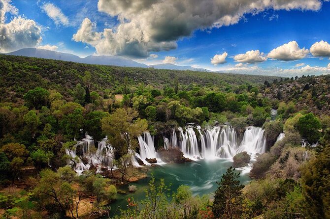 Bosnia Day Trip: Mostar and Kravice Waterfalls by Luxury Minibus - Walking across Mostar’s polished Old Bridge