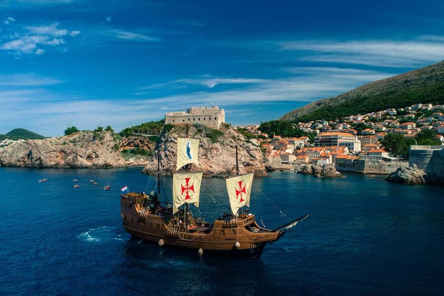 Dubrovnik: Galleon Sunset Cruise with a Live Guide & Drink - A welcome drink before the sun drops