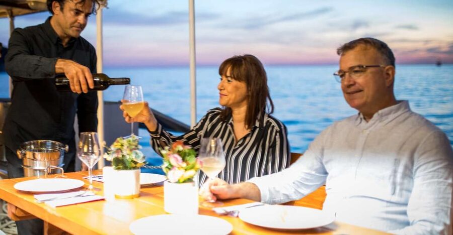 Dubrovnik: Sunset Dinner Cruise around the Old Town - Local snacks and drinks set the tone