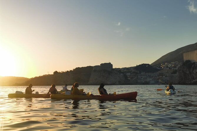 Dubrovnik: Sunset Kayak & Snorkel Tour with Wine & Water - Returning beside Dubrovnik’s Old Town