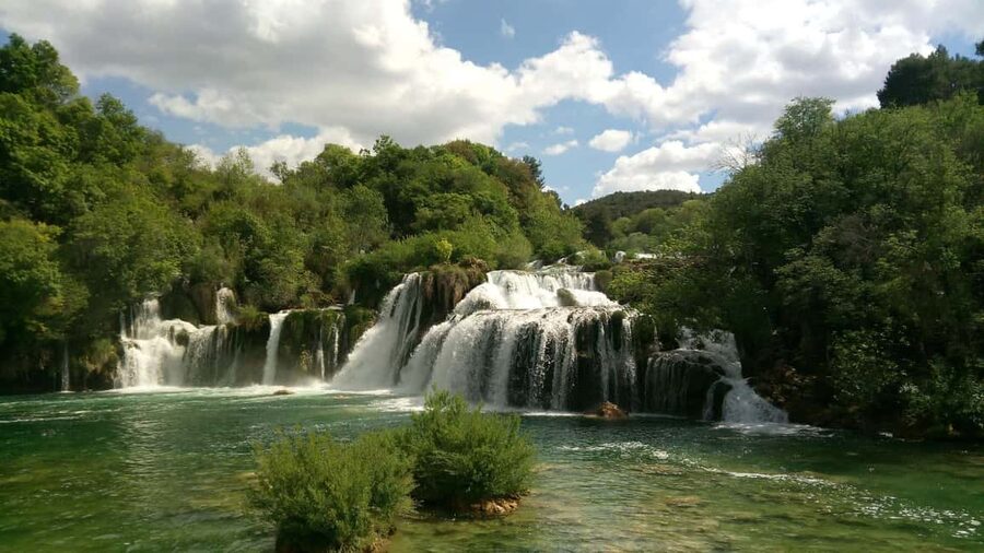 From Makarska: Krka Waterfalls & Šibenik Day Trip - Walking beside the waterfalls