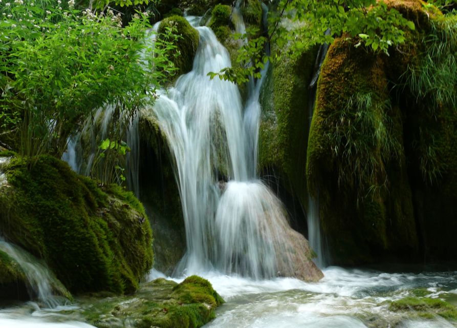 From Omiš: Krka Waterfalls and Trogir Small Group Tour - Walking the wooden trails around Skradinski Buk