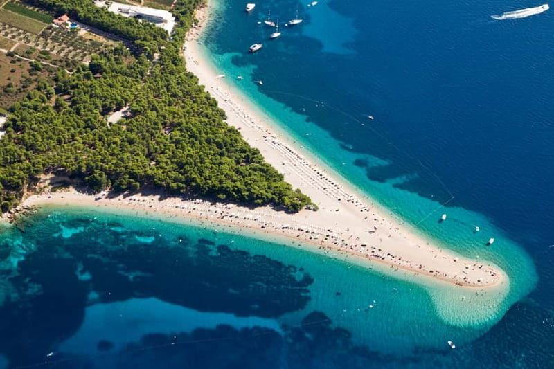From Split: Catamaran Cruise to Golden Horn & Brač island. - Lunch, vineyards, and the southern coast