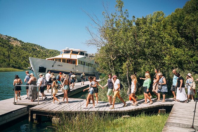 From Split: Krka Waterfalls, Food & Wine Tasting Tour - Walking the wooden trail at Skradinski buk
