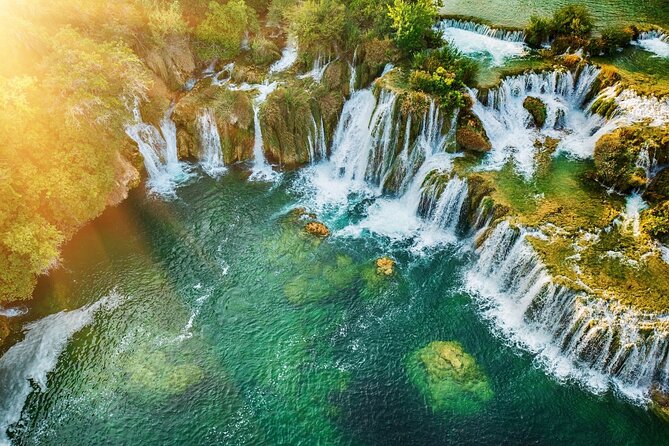 From Split: Krka Waterfalls Trip with Boat Cruise and Swimming - Riding the river to Skradinski Buk