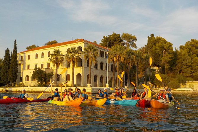 Half-Day Split Sea Kayak Adventure - A beach stop with swimming, snorkeling, and cliff jumping