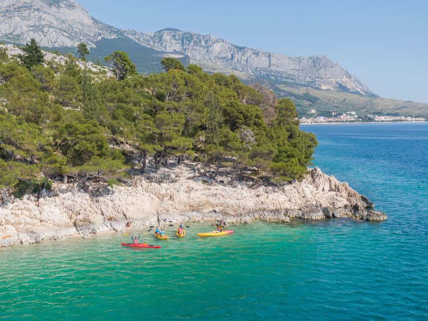 Makarska: Guided Sea Kayaking Tour with Snorkeling Stop - The first paddle toward St. Peter Lighthouse