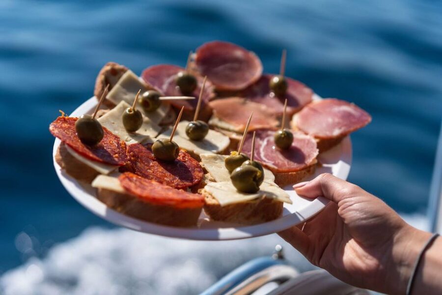 Opatija/Lovran: Boat Trip to Secluded Beaches on Island Cres - Brseč Beach, cliffs above a clear pebble shore