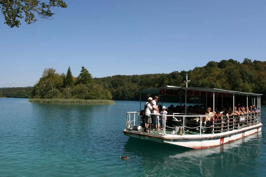 Plitvice Lakes: Guided Walking Tour with Boat Ride - Reaching the upper lakes and a quieter side of the park