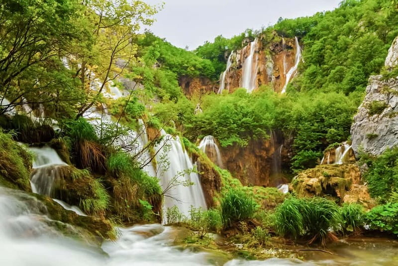 Plitvice Lakes: Guided Walking Tour with Train and Boat Ride - Walking the lower lakes and waterfalls