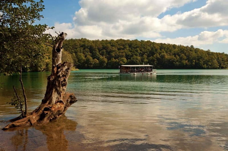 Plitvice Lakes: Guided Walking Tour with Train and Boat Ride - Reaching the upper lakes