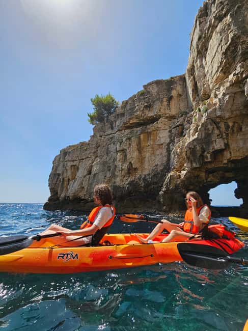 Pula: Cave Kayak Tour, Snorkeling and Island Jumping - What the guides add