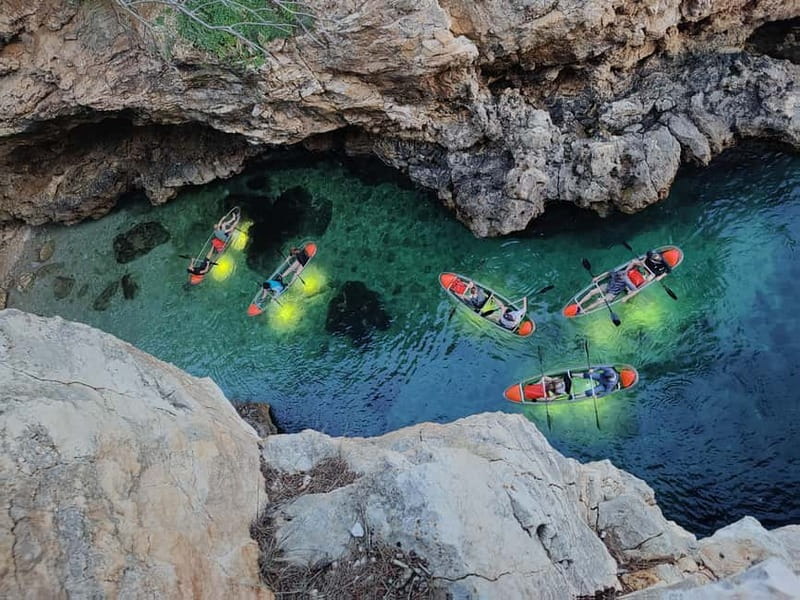 Pula: Cave Sunset/Night Tour in Transparent Kayak - Looking through the clear kayak at night