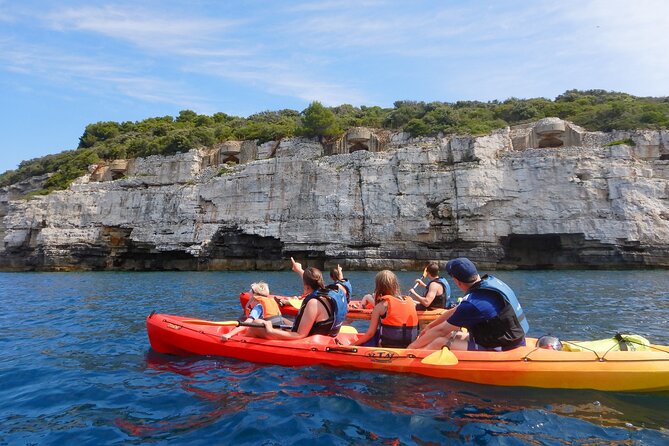 Pula Kayak, Cliffs & Snorkeling Adventure - Cliff jumping with a guide nearby