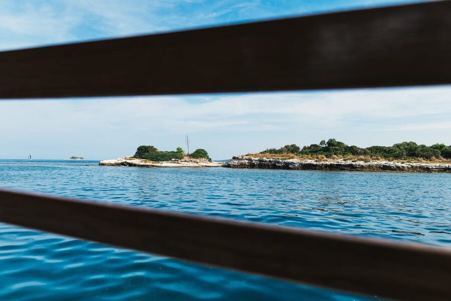 Rovinj: Sunset Cruise with Swim Stop, Drinks, and Fruits - Sunset views from the upper deck