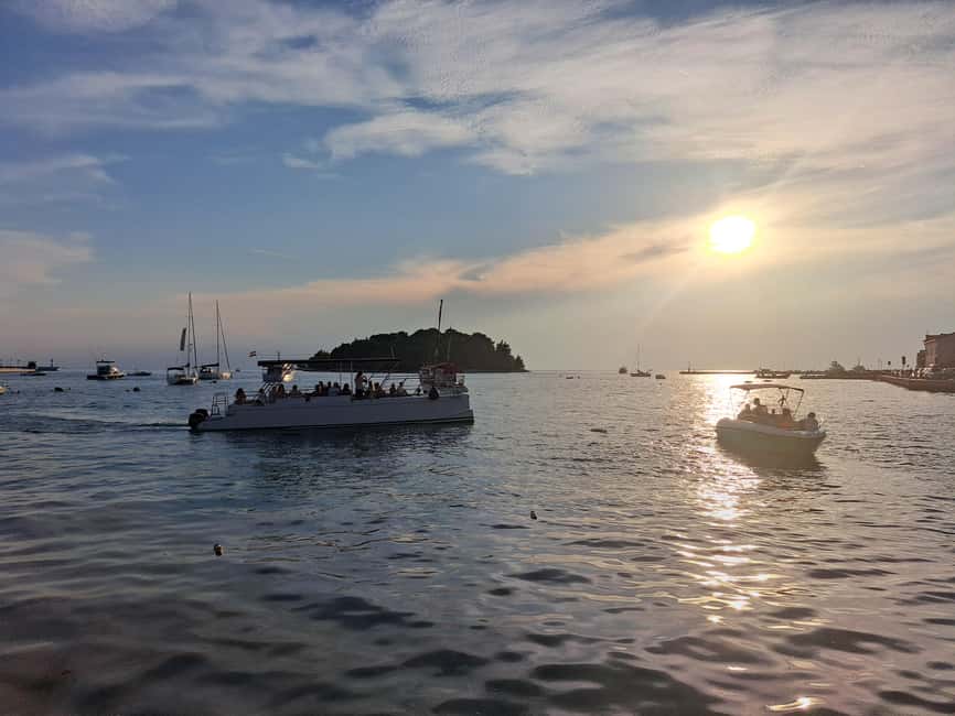 Rovinj: Sunset & dolphin group tours with Catamaran - A short coastal view with plenty of photo chances