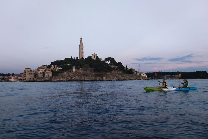 Rovinj Sunset kayaking tour - Paddling toward the old port and St. Eufemia