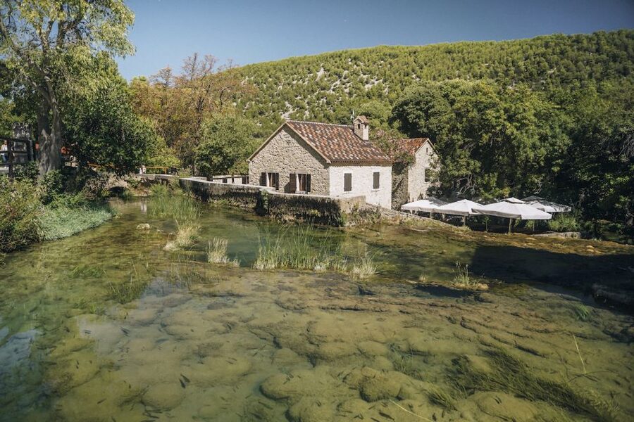 Split: Krka Waterfalls Tour, Boat Cruise, and Swimming - Taking the boat toward Skradin