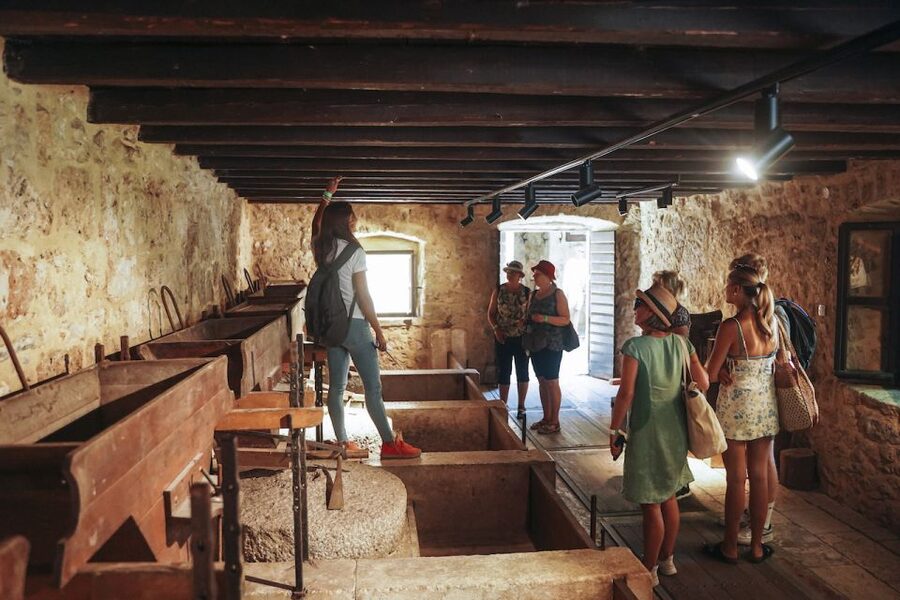 Split: Krka Waterfalls Tour, Boat Cruise, and Swimming - Walking through the ethno-village