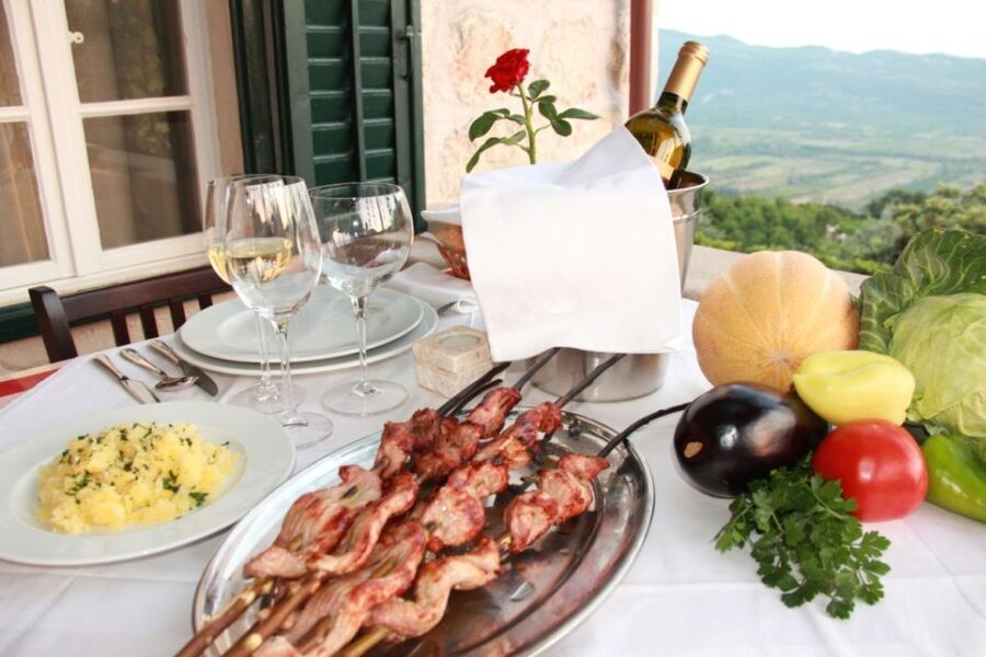Traditional Dalmatian Cooking Class from Dubrovnik - Picking vegetables, tasting herbs, and making bread