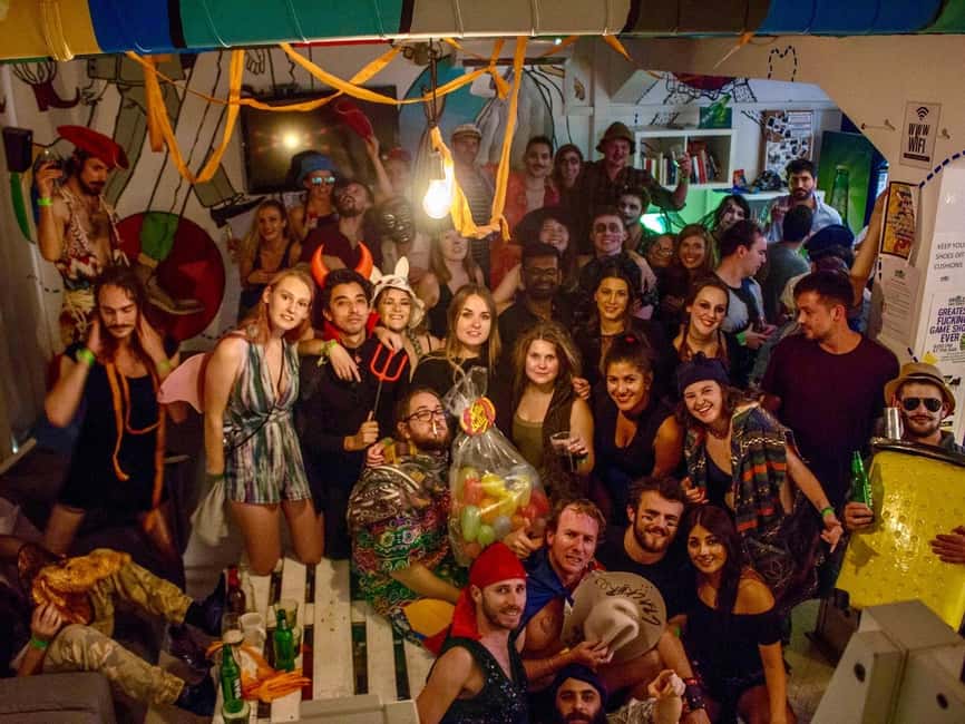Zagreb: Pub Crawl, 1-Hour of Unlimited Drinks, & Club Entry - Starting at Whole Wide World Hostel with a full glass